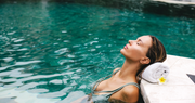 woman swimming in pool after laser hair removal 